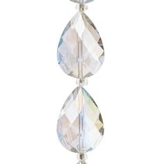 three tear shaped crystal beads hanging from a hook on a white background with clippings