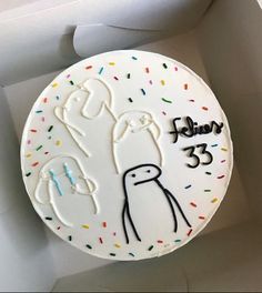 a birthday cake with an image of a penguin on it