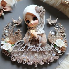 a close up of a doll on a table with brooches and other decorations