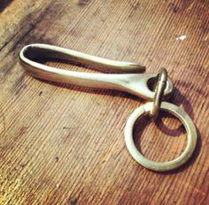 an old pair of scissors on a wooden table