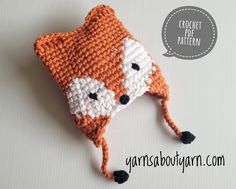 a crocheted hat with a fox pattern on it