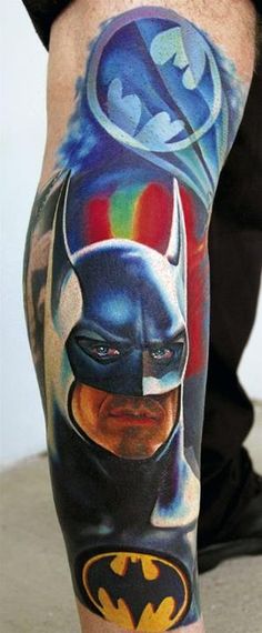 a man with a batman tattoo on his leg