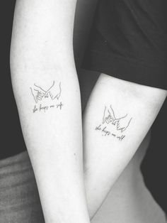 two people with matching tattoos on their arms