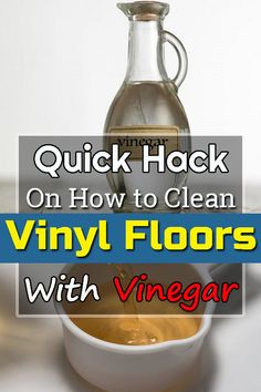 a bottle of vinegar sitting on top of a table next to a bowl and spoon