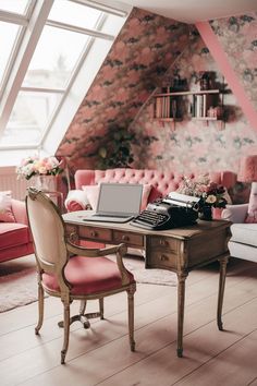 a desk with a laptop computer on top of it next to a couch and chair