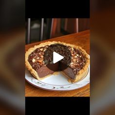 a chocolate pie with one slice missing from it