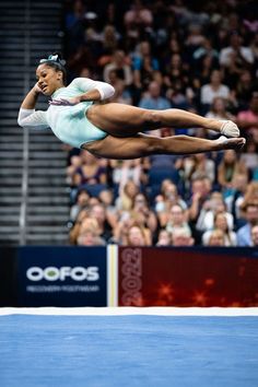 a female tennis player in mid air after hitting the ball