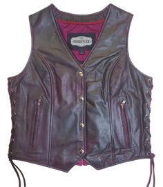 This ladies' vest features a soft purple color, V-neck design, and lace detailing on the sides for a casual and comfortable look. Made from lightweight Lambskin. The 3 panel pack and snap front closure add to the practicality of this vest. Not to mention, the V-notch on the lower back ensures a perfect fit. Visit our leather shop in Smyrna, TN, near Nashville, and choose from sizes XS to 5X. Includes inside Carry conceal pockets and zippered Right and Left pockets Side lace for size adjustment 3 Ladies Vest, Western Buckles, Western Belt Buckles, Leather Shirt, Soft Purple, Lady Biker, Leather Vest, Best Bags, Leather Shops