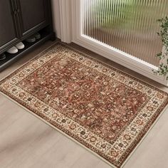 a large rug in the corner of a room next to a window with blinds on it