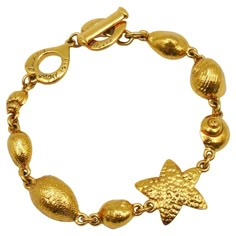 YVES SAINT LAURENT vintage link bracelet featuring a sealife design. Gold tone metal hardware. Spring/Summer 1994 Collection. T bar closure. Love heart clasp. Embossed YVES SAINT LAURENT on the love hearts. Indicative measurements : adjustable length from approx. 21 cm (8.27 inches) to approx. 23 cm (9.06 inches) / max. width approx. 2.1 cm (0.83 inch). NOTES - This is a preloved vintage item, therefore it might have imperfections. - Colors may differ slightly from actual product appearance due Yves Saint Laurent Vintage Jewelry, Ysl Jewelry, Ysl Vintage, Saint Laurent Vintage, Vintage Ysl, Vintage Spring, Vintage Jewels, Jewelry Inspo, Metal Hardware