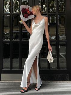 Elevate your summer wardrobe with our Satin Halter Neck Slip Dress. This sizzling hot, high-slit, open-back spaghetti strap dress is crafted from a blend of 95% polyester and 5% spandex, ensuring both style and comfort. Perfect for everyday wear, leisure vacations, or commuting, it effortlessly adds a touch of allure to any occasion. Whether it's Valentine's Day, a birthday, or Christmas, this trendy dress makes a thoughtful gift for any celebration. Washing Tip: Hand wash recommended, hang dry. Sleeveless Outfit, Spaghetti Strap Maxi Dress, Club Party Dresses, Split Maxi Dress, Costume Intero, Split Dress, Sling Dress, Suspender Dress, Satin Maxi Dress