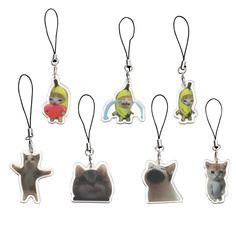 six different key chains with pictures of cats on them