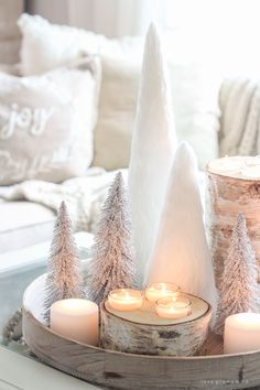 a tray with candles and trees on it