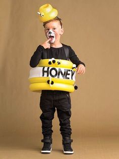 a young boy wearing a honey bear costume