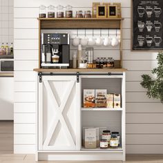 a small coffee bar in a kitchen next to a potted plant