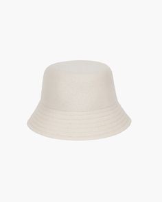 A cozy, lightweight women's bucket hat of spun wool with trapunto stitched brim rolls up easily into a coat pocket or a tote bag. Eric says, "It's definitely a bucket hat season where the attitude is a bit more casual than a fedora." What makes this women's bucket hat most desirable is that the crown is spun and then blocked to achieve the shape; The crown has no visible seams so it doesn't feel thick, while providing great insulation and protection from the elements. Brim span: 2.75"(7cm) Fully Beige Bucket Hat For Everyday, Casual Summer Felt Hat For Everyday, Casual Everyday Felt Hat For Summer, Casual Wool Cloche Hat With Short Brim, Chic Solid Color Bucket Hat, Casual Everyday Summer Felt Hat, Beige Short Brim Felt Hat For Everyday, Trendy Short Brim Bucket Hat For Travel, Casual Cream Felt Hat For Winter