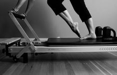 two people standing on top of a treadmill with their feet on the treadmill