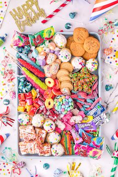 a tray filled with lots of candy and cookies