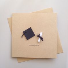 two graduation cards, one with a black cap and the other has a white ribbon