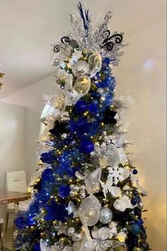 29 Blue Christmas Tree Ideas: Bringing Winter Magic Into Your Home - ReenaSidhu Turquoise Tree Christmas, White And Blue Tree Christmas, White And Light Blue Christmas Tree, Navy White And Silver Christmas Tree, Christmas Tree Blue And Silver Ideas Decorations, Silver And Navy Christmas Tree, Christmas Decor Ideas Blue And White, Royal Blue And Silver Christmas Tree, Color Theme Christmas Tree Ideas