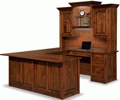 an office desk and hutch with a laptop on it