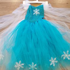 It Is A Super Puffy Layered Elsa Dress. Very Pretty And Princes Feeling. The Body Part Is Soft Knitted With A Lining And It Is Stretchy. The Skirt Has A Soft Lining As Well. Straps Are Adjective. Can Fit Girls From Age 7-12. New With Tag. Great Not Just For Halloween But A Princess Theme Party. Good Quality Piece, Not Cheap Halloween One-Time Using Custom Material. Girls Will Love It~ Winter Princess Style Fitted Tutu Dress, Blue Princess Dress For Winter, White Winter Dress For Dress-up Occasions, Blue Winter Princess Dress, Cute Blue Tutu Dress For Dress-up, Blue Sleeveless Tutu Dress For Dress-up, Frozen Birthday Dress Elsa, Princess Elsa Dress Kids, Elsa Style