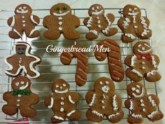 gingerbread men are arranged on a cooling rack