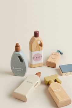 several wooden objects including soap, toothbrush and other items on a white surface with the word bleach printed on it