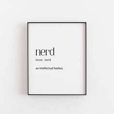 a black and white framed print with the words nerd in cursive writing