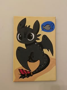 a painting of a black dragon sitting on top of a yellow wall