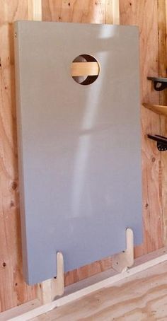 a large metal object on top of a wooden shelf in a room that is being built