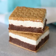 two pieces of chocolate and marshmallow ice cream sandwich sitting on top of each other