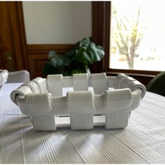 a white bowl sitting on top of a table