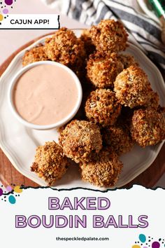 baked boudiin balls on a white plate with dipping sauce in the middle and text overlay