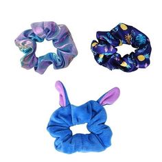 three scrunchy hair ties in various colors and designs, one blue, the other purple