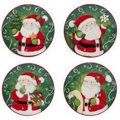 four christmas plates with santa clause on them