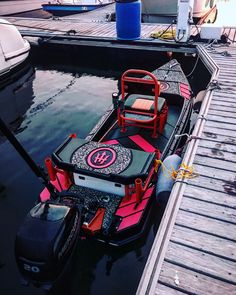 a small boat is tied to the dock