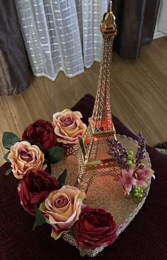 the eiffel tower is adorned with flowers