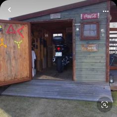 a motorcycle is parked in the back of a shed