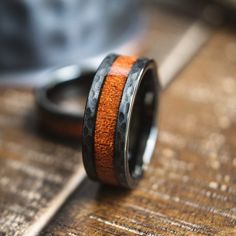 two rings with wood in them sitting on top of a wooden table