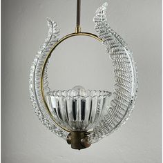 a glass chandelier hanging from a ceiling