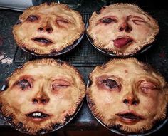 four pies with faces drawn on them