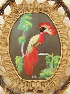 a basket with a bird painted on it