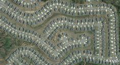 an aerial view of many rows of houses