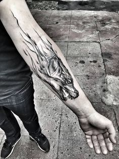 a person with a tattoo on their arm