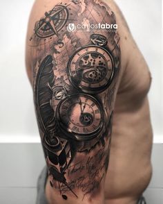 a man's arm with a clock and compass tattoo on it