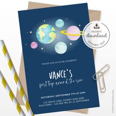 a birthday card with an image of the planets on it and two straws next to it