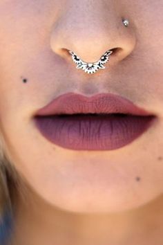 a woman's nose with a piercing on it