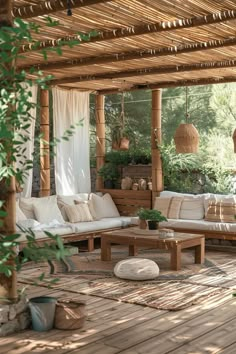 an outdoor living area with couches and tables