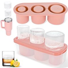 the ice tray is filled with three glasses